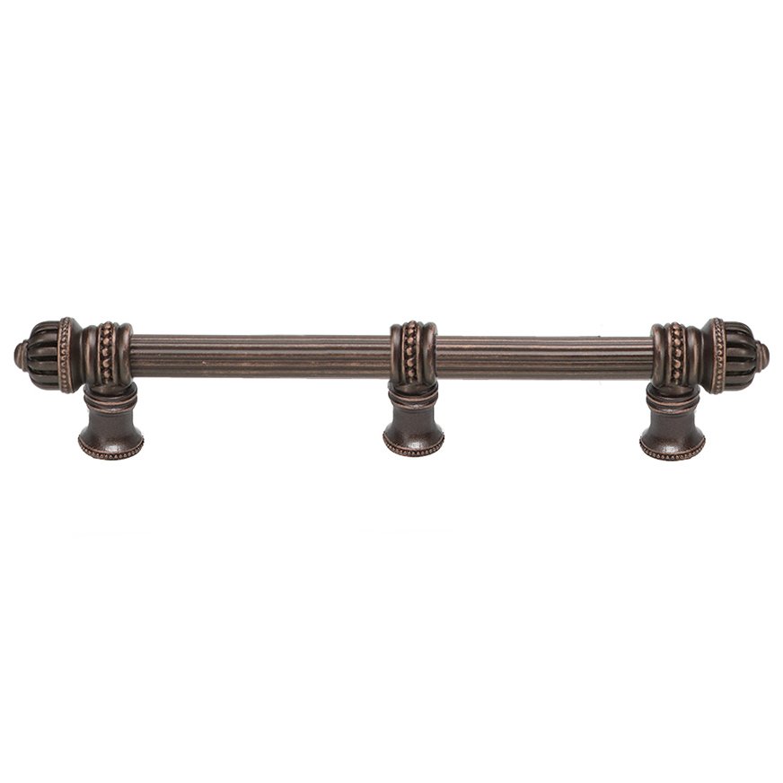 9" Centers Reeded Pull With Small Finial And Center Brace in Antique Brass