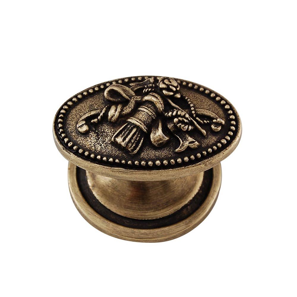 Oval Trim & Tassel Knob in Antique Brass